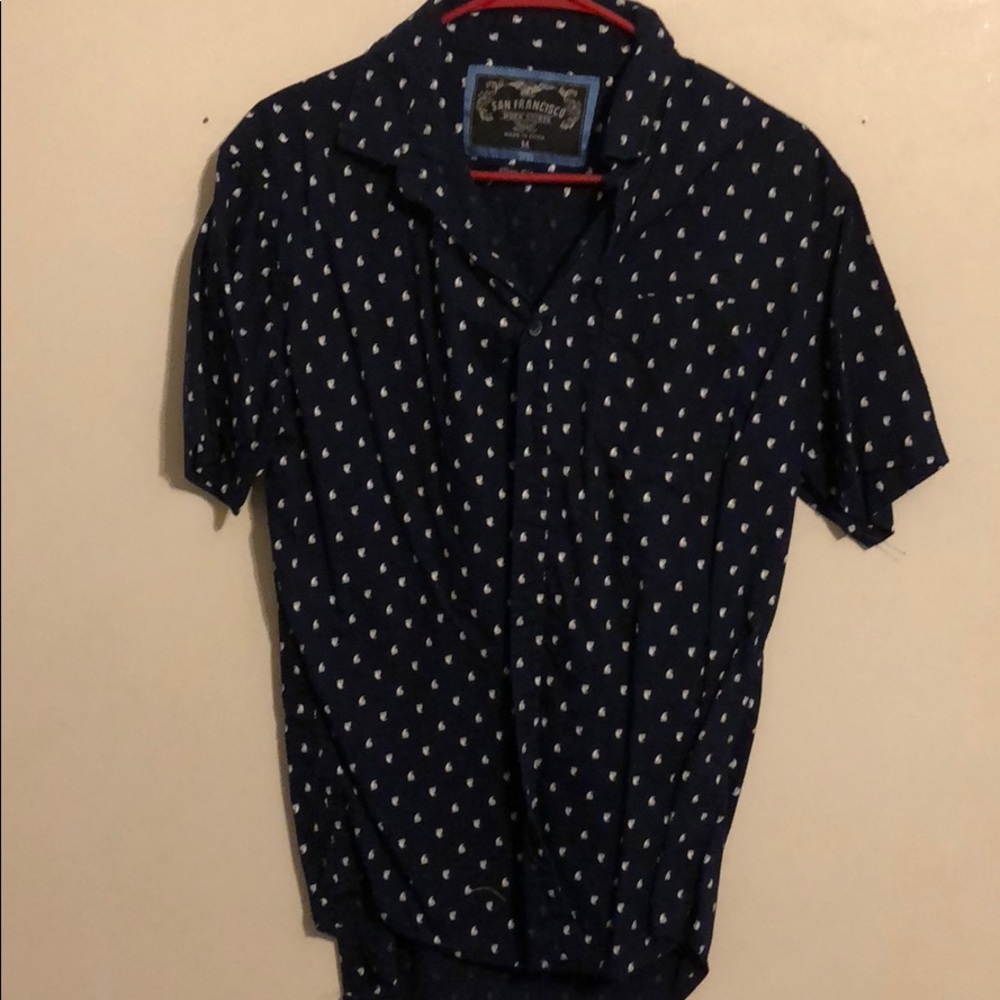A dress shirt sleeve shirt with boats